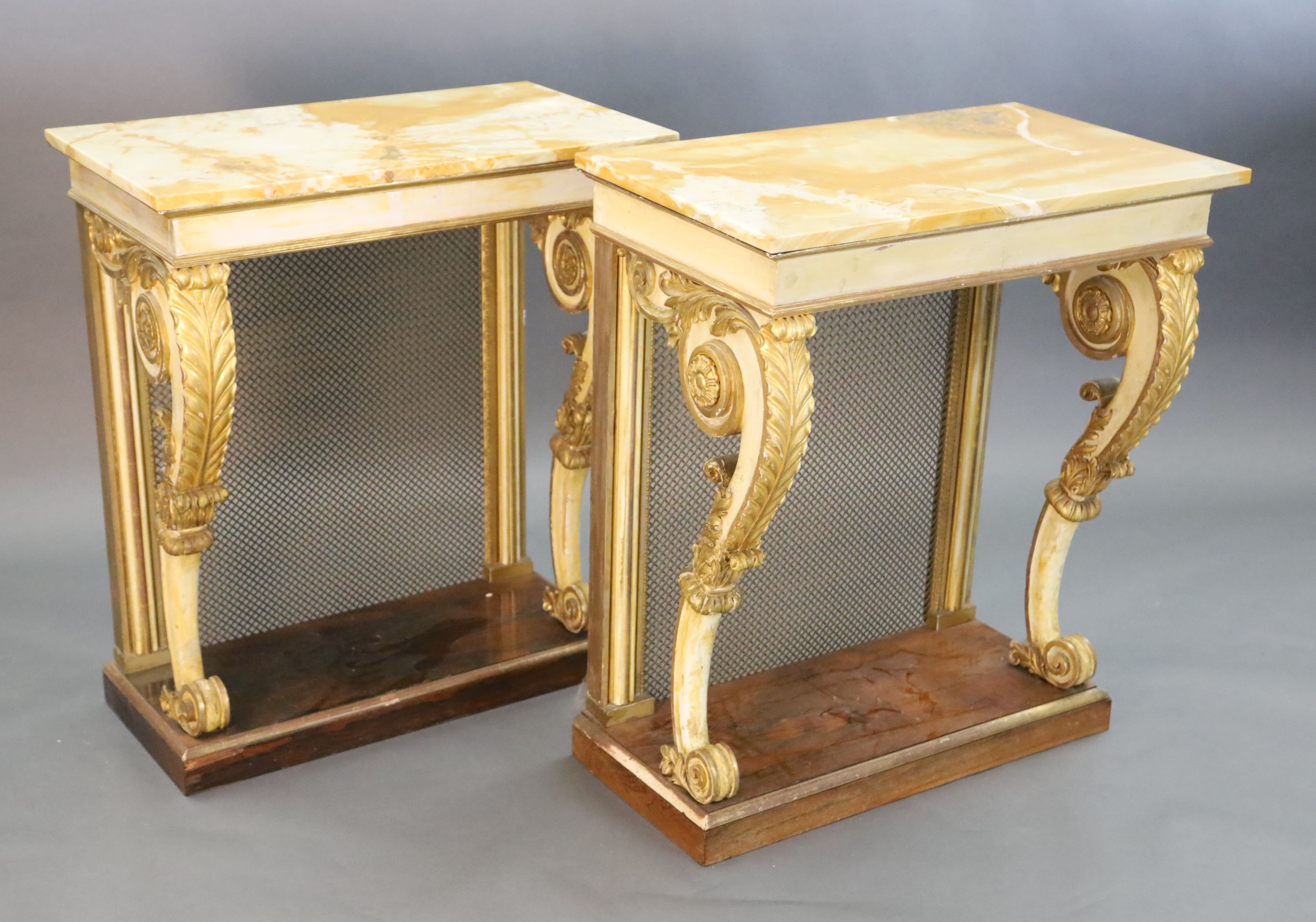 A pair of William IV parcel gilt cream painted and rosewood console tables, W.2ft 6in. D.1ft 6.5in. H.2ft 11.5in.